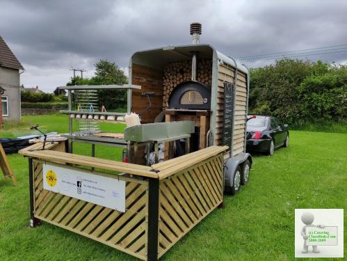 mobile wood fired pizza catering trailer.